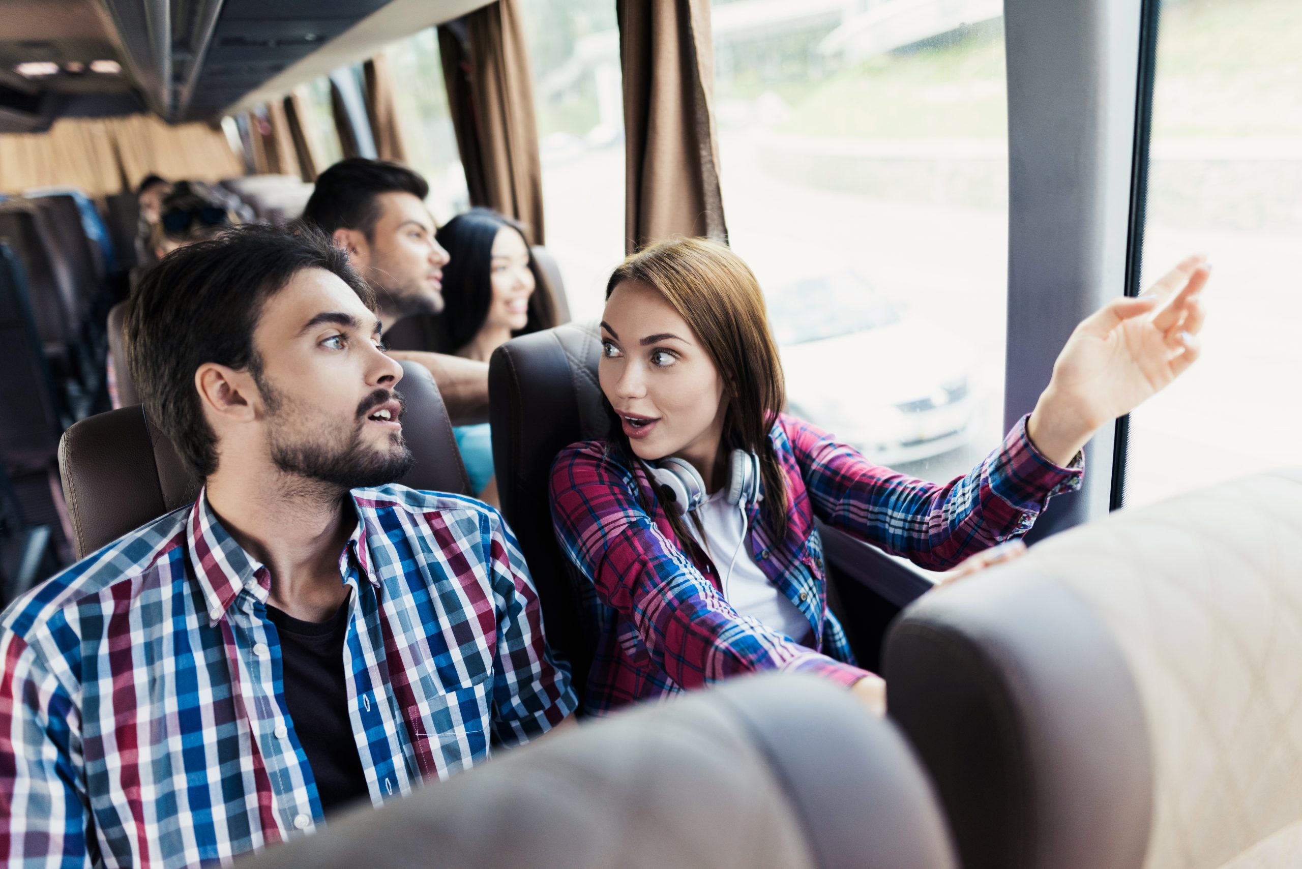 Woman and the guy are discussing something and smiling.